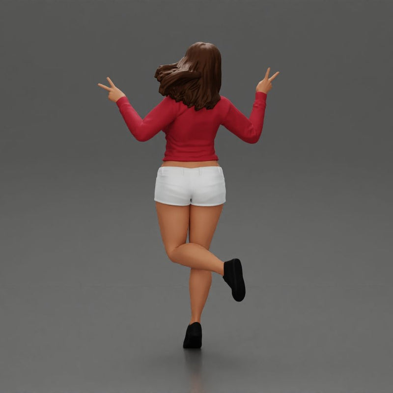 happy girl in a mini jacket and shorts, jumping on one leg