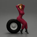 2 Models - SEXY GIRL MECHANIC IN SUIT SITTING ON A TRUCK TYRE AND HANDS IN HAIR - Only-Games