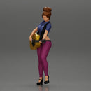 Young woman with short hair standing playing on an acoustic guitar on stage - Only-Games