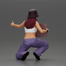 Young girl wearing a hat and pants sitting holding a sign and hitchhiking - Only-Games