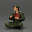 Jamie Farr sitting while eating breakfast in the MASH series - Only-Games