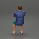 Young man  driving a boat in shorts a shirt and sandals - Only-Games