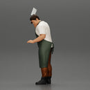 butcher standing while holding a cleaver and cutting something - Only-Games