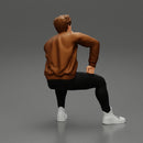 man in leather jacket sitting in thinking pose - Only-Games