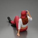 Tired woman mechanic in shirt pants and backwards cap sitting and drinking water during from bottle - Only-Games