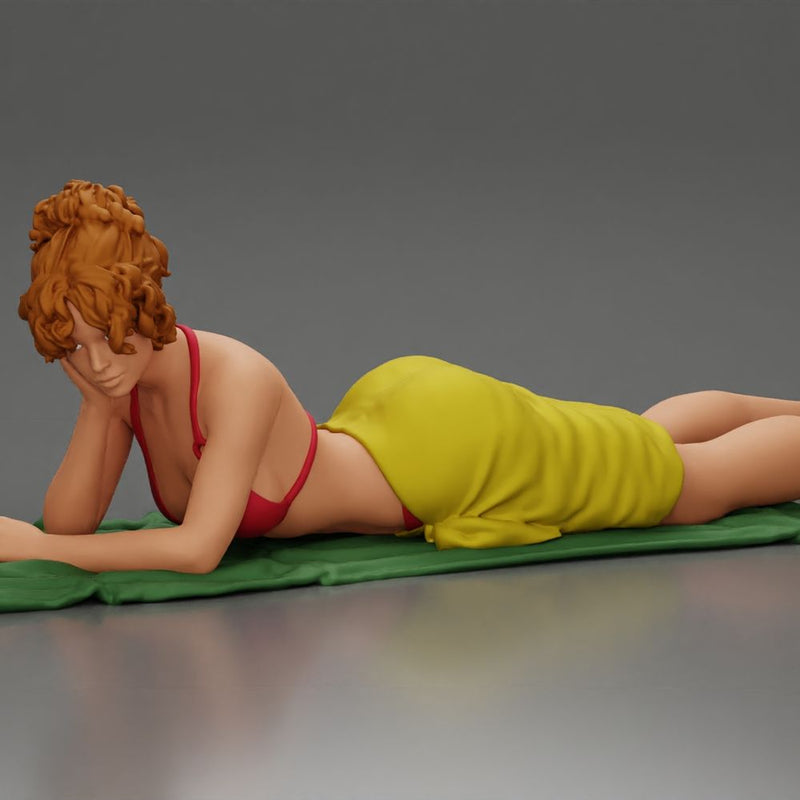 Relaxing on a beach towel, a woman enjoys sunbathing, wrapped in a pareo beach cover and bikini - Only-Games