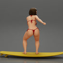 Sexy Girl in A Bikini Swimsuit Riding Wave on board - Only-Games
