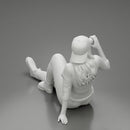 Tired woman mechanic in shirt pants and backwards cap sitting and drinking water during from bottle - Only-Games