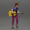 Young woman with short hair standing playing on an acoustic guitar on stage - Only-Games