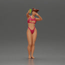 attractive woman in bikini taking a selfie with her phone on the beach - Only-Games