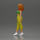 Curly-Haired Woman in Vibrant Green Outfit Striking a Pose - Only-Games