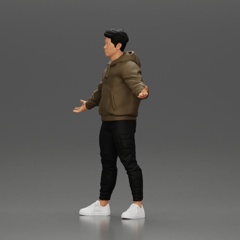 Asian Man Standing in Hoodie with Raised Hands