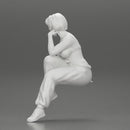 young woman sitting taking off her bib overalls - Only-Games