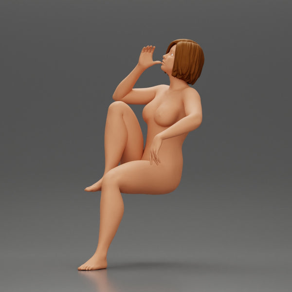 naked woman sitting on a chair hugging her pulled-up leg while drinking