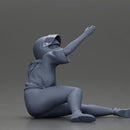 Biker Girl in a helmet who fell off a motorbike, being helped by a man - Only-Games