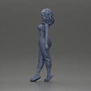 Curly-Haired Woman in Vibrant Green Outfit Striking a Pose - Only-Games