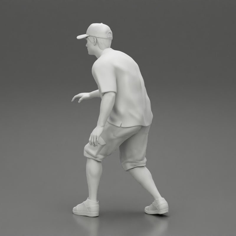 Man bent over while walking in cap - Only-Games