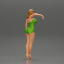 Sexy girl in onepiece standing with her friend on the beach - Only-Games