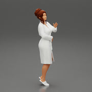 woman in a white bathrobe standing - Only-Games