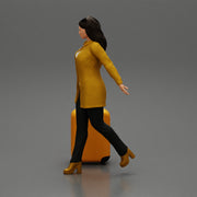 Business woman in manteau dragging suitcase  walking in airport terminal - Only-Games