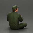 Jamie Farr sitting while eating breakfast in the MASH series - Only-Games