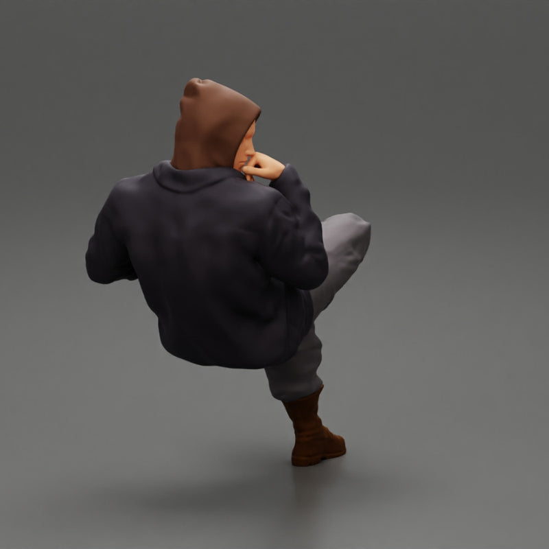 man in leather jacket and jeans sitting cross legged and thinking - Only-Games