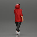 Man in a long hoodie  walking and looking at his watch - Only-Games