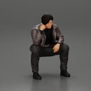 Worried man in a leather jacket sitting and thinking - Only-Games