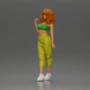 Curly-Haired Woman in Vibrant Green Outfit Striking a Pose - Only-Games
