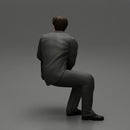 businessman sitting and holding briefcase of money - Only-Games