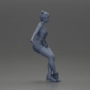 Asian girl wearing shorts sits on motorcycle - Only-Games