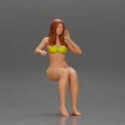 Sexy girl in a bikini sitting on a boat - Only-Games