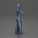 Stylish woman in a crop top and pants, standing thoughtfully - Only-Games