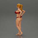 Fit hot woman in bikini taking off swimsuit panties on the beach - Only-Games