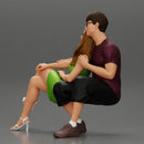 couple sitting on a bench in the park - Only-Games