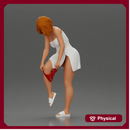 Woman in white towel lifting leg while putting on red underwear