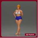 woman posing barefoot wearing bikini top and shorts stylishly