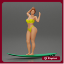 young girl posing and riding on the surfboard at the beach