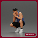 gangster man in shorts and a cap sitting and thinking