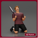tennis player holding racket sits in celebration of his victory