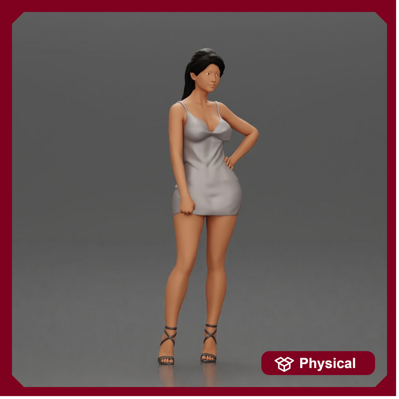 Woman in silver mini dress posing with hand on hip