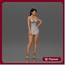 Woman in silver mini dress posing with hand on hip