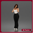 Thoughtful woman stands daydreaming wearing crop tank top and trousers