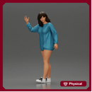Sexy girl in a long shirt and shoes walks by waving hello to someone