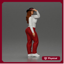 woman in red pants striking stylish pose with hat