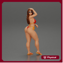 Sexy girl in a bikini sunglasses and sandals posing putting her hand on her hair