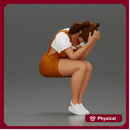 Crying girl sitting low in orange dress with head in hands