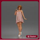 Chic woman chatting on phone wearing flowy mini dress and heels