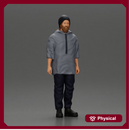 man wearing a hat and hoodie stands confidently watching intently
