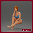 Woman sitting in Blue Bikini Ponders with Relaxed Posture